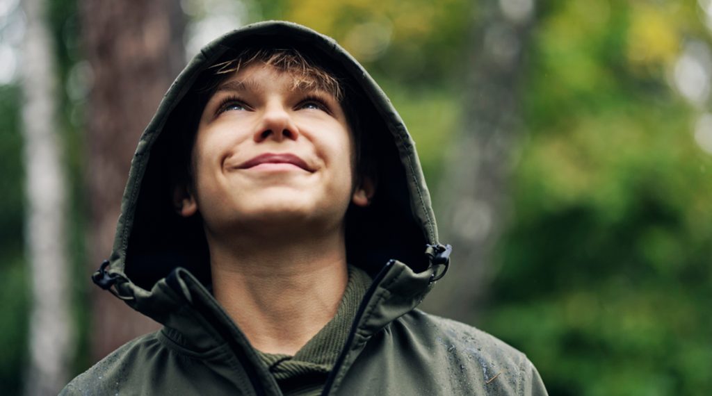 Teen outdoors focusing on coping with intrusive thoughts